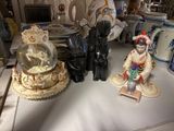 several figurines are sitting on a table in a room