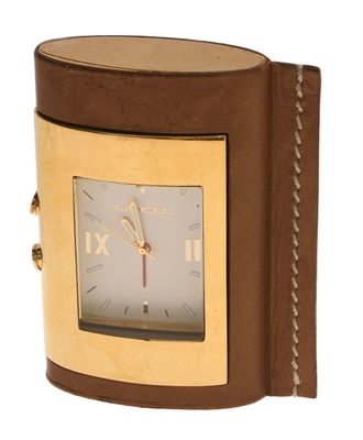 brown leather watch case with gold plated face and roman numerals