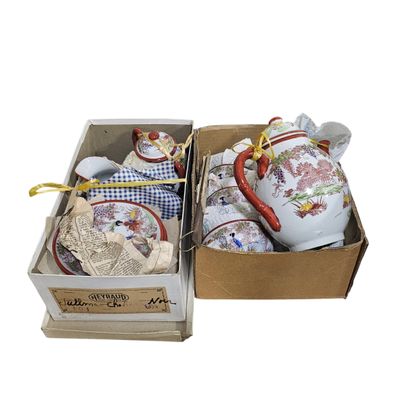 two teapots that are sitting in a box