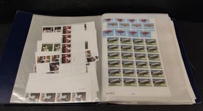 an open book with stamps on it sitting on a table