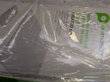 a plastic bag that has a pair of scissors in it