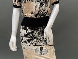 an image of a mannequin wearing a dress with a black and white design