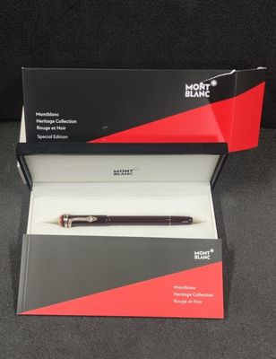 a box with a pen inside of it sitting on a table