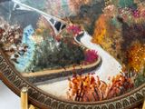 a picture of a painting of a road going through the woods