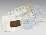 several papers and a wallet sitting on top of a table