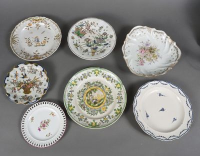 several plates with different designs and designs on them on a table