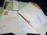 a pile of papers sitting on top of a table