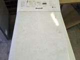 a white dishwasher sitting on top of a counter
