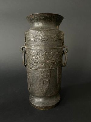 an old silver vase with handles and handles on a black background