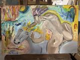 a painting of a man riding a horse on a easel
