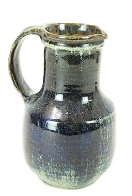 a blue vase with a brown handle on a white background
