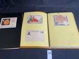 an open book with stamps and stamps on it sitting on a table