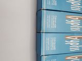 four boxes of cigarettes stacked on top of each other on a shelf