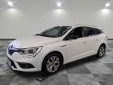 a white car parked in a room with a checkered floor