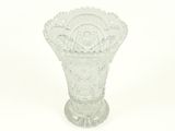 a glass vase that is sitting on a white surface