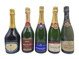 six bottles of champagne are lined up in a row