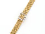 a gold mesh bracelet with a diamond clasp