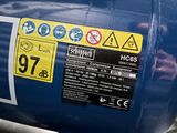 a close up of a blue tank with a yellow sign on it