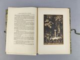 an open book with a picture of a man on a horse in a forest