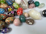 a lot of different colored stones on a white surface