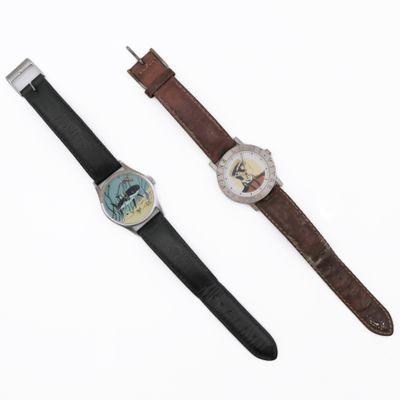 an image of a couple of watches sitting next to each other