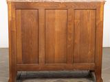 an image of a wooden cabinet with a marble top