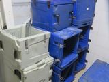 several blue and white boxes stacked on top of each other in a room