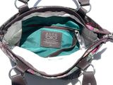a purse that is sitting on a white surface