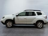 a picture of a white dacia parked in a garage