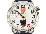 a close up of a watch with a teddy bear on the face