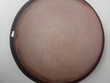a picture of a brown and white plate on a white table