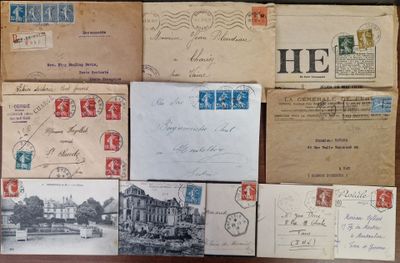 several old postcards and envelopes on a wooden table