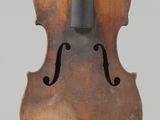 an old violin with a black bow on a white background