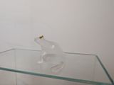 a glass table with a glass frog on it