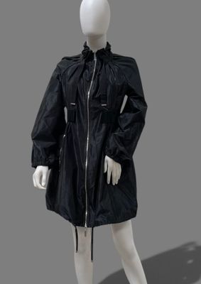 an image of a mannequin dressed in a black rain coat
