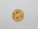 a gold coin with a picture of a man on it