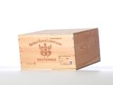 a wooden box with a label on it on a table