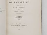 an open book on a white table with a black and white picture