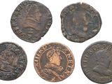 a group of four ancient roman coins on a white background
