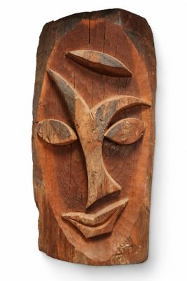 an image of a wooden sculpture of a face on a white background