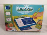 the box is open on a white surface with a drawing board in it