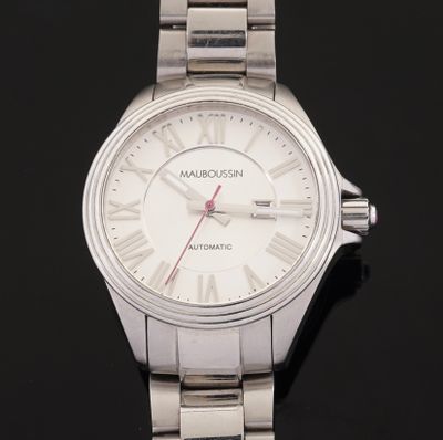 an image of a close up of a wrist watch on a black surface
