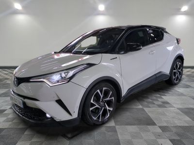 the toyota c - hr is parked on a checkered tile floor