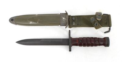 a knife and a knife sheath on a white surface