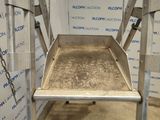 an image of a metal tray on a metal stand