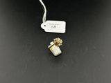a white and gold ring with a flower on top of it