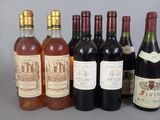 several bottles of wine are lined up on a table