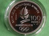 a close up of a coin on a green surface