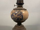 a lamp that has a blue and white design on it