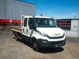 a white truck that is parked in front of a building